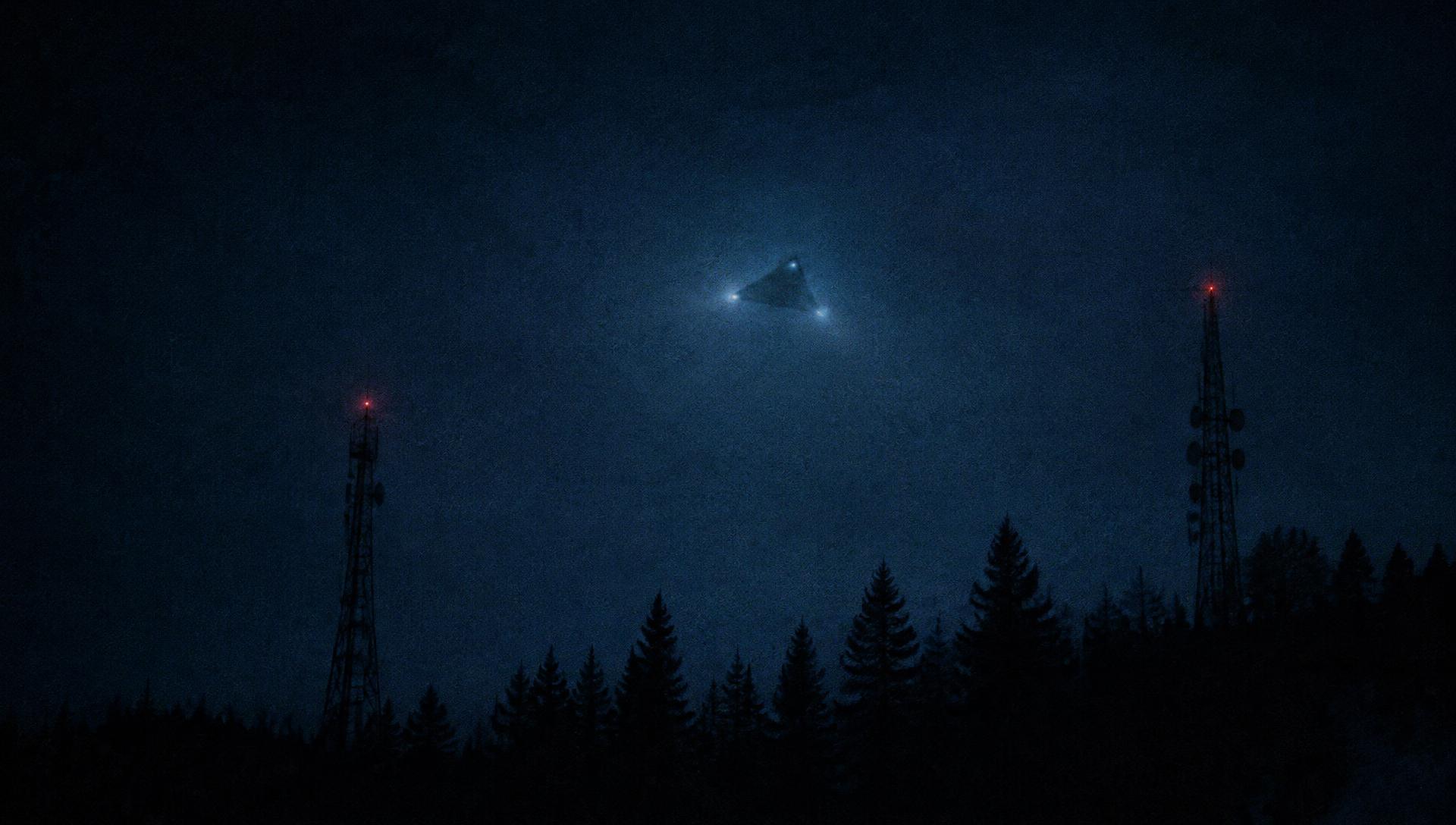 An unidentified triangular object over a dark forest